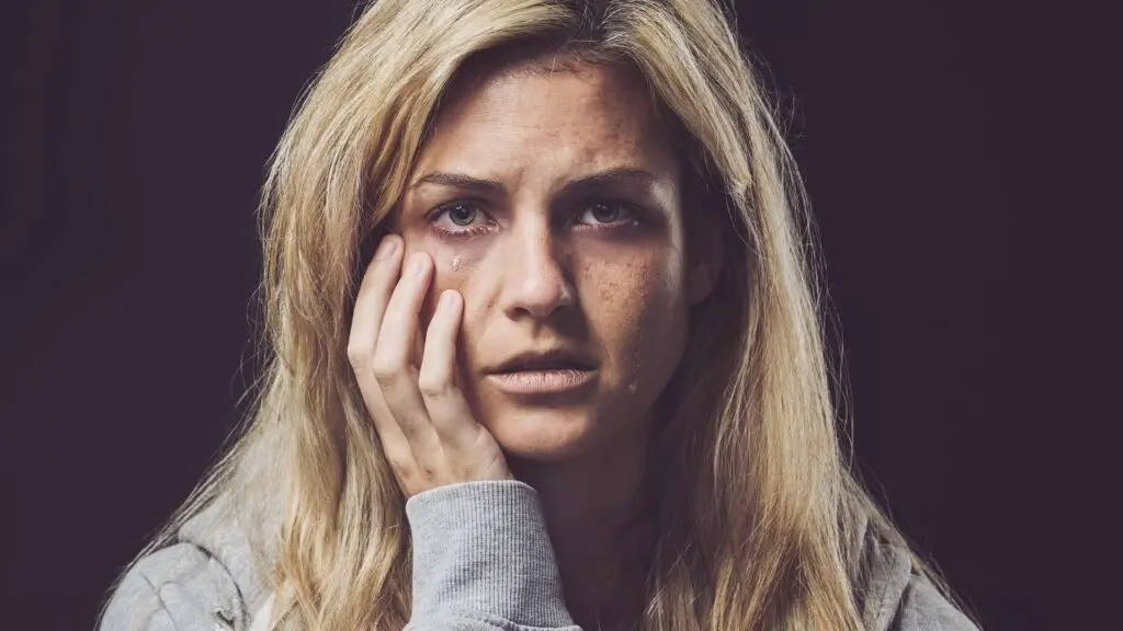 a woman dealing with individual factors affecting her opioid addiction