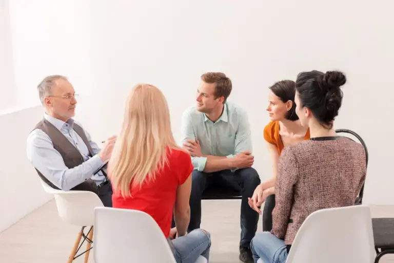 pink-cloud-syndrome-signs-and-risks group therapy session discussing pink cloud syndrome in recovery