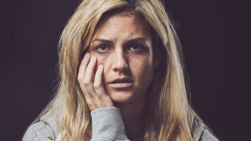 a woman dealing with individual factors affecting her opioid addiction