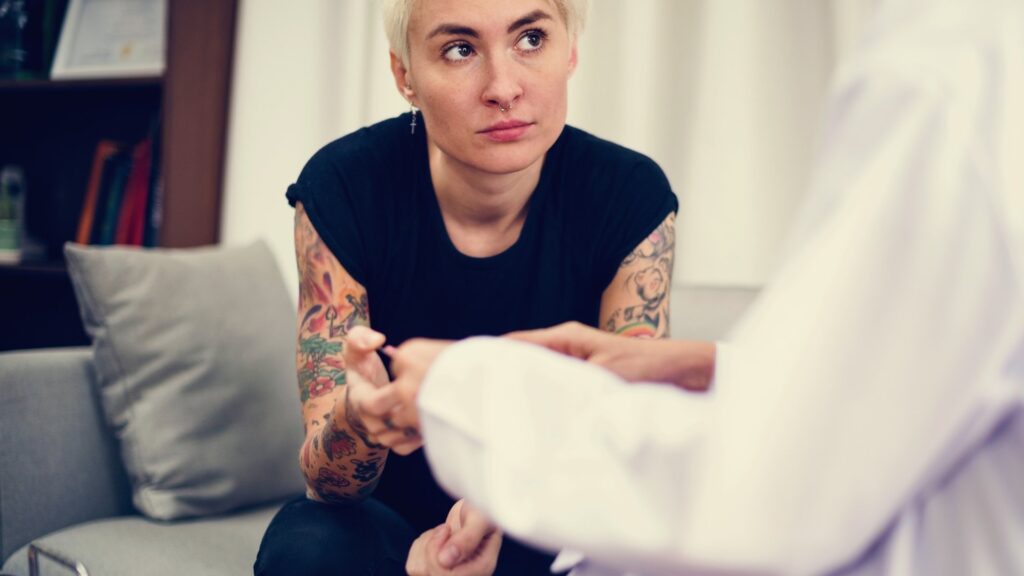 clinician watching woman with opioid withdrawal