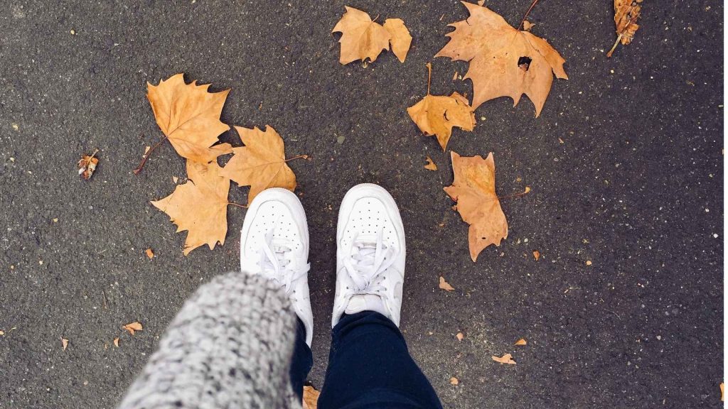 Person standing on a sidewalk symbolizing the first steps toward marijuana addiction recovery.