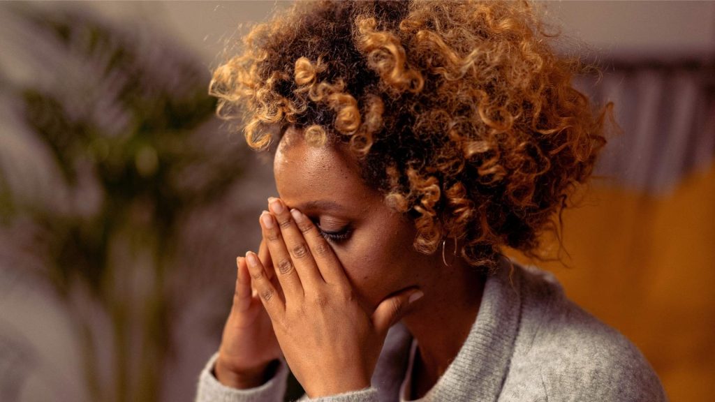 Woman experiencing anxiety and mood changes related to marijuana withdrawal.