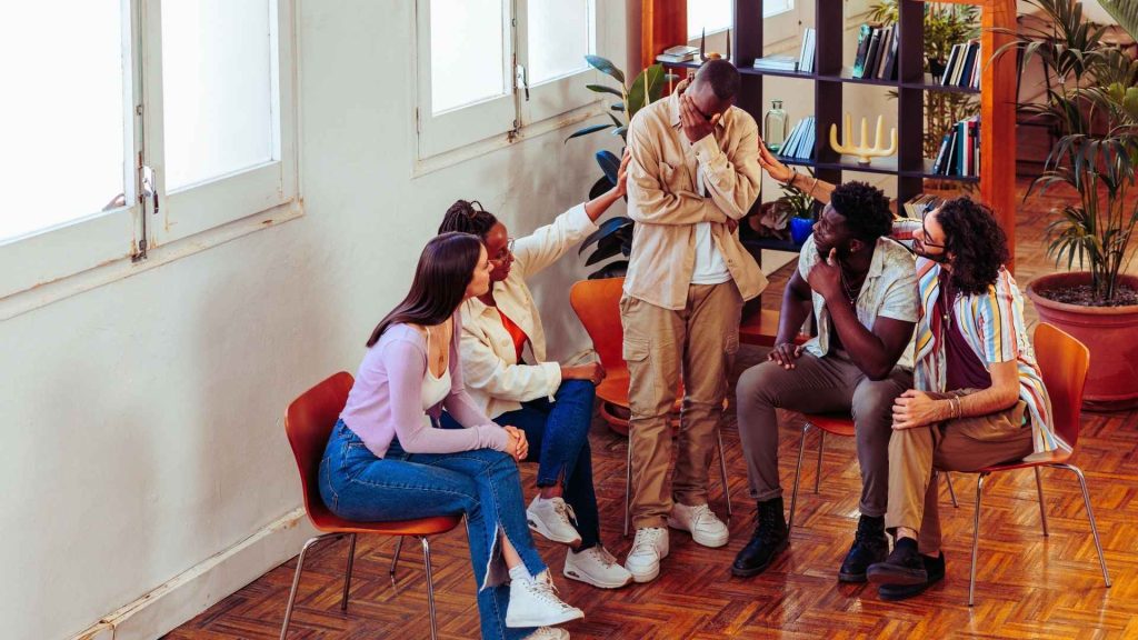 Support group offering encouragement during alcohol addiction treatment