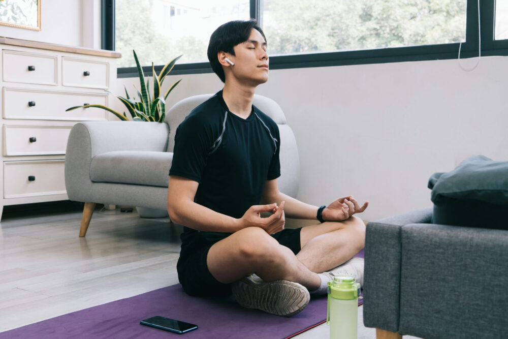 man practicing meditation in recovery